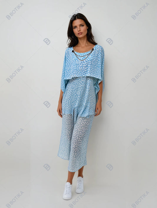 “Elegant Sky-Blue Polka Dot Jumpsuit with Sheer Layer and Chic Gold Accents”